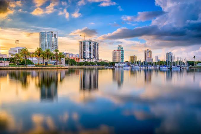 St. Petersburg waterfront skyline reflected across the marina